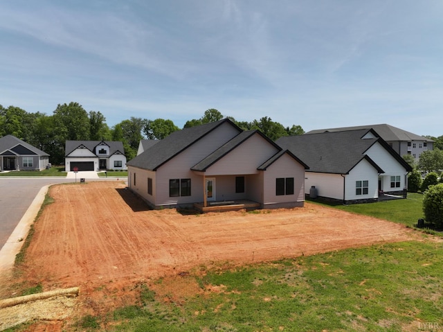24 Stony Ridge Blvd, Forest, VA 24551 - back of property featuring driveway, a yard, and a garage