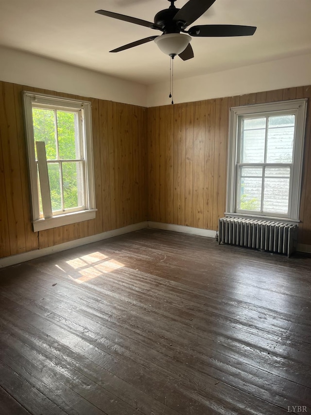 1115 Jackson St, Lynchburg, VA 24504 - unfurnished room featuring radiator, dark wood-style floors, ceiling fan, and baseboards