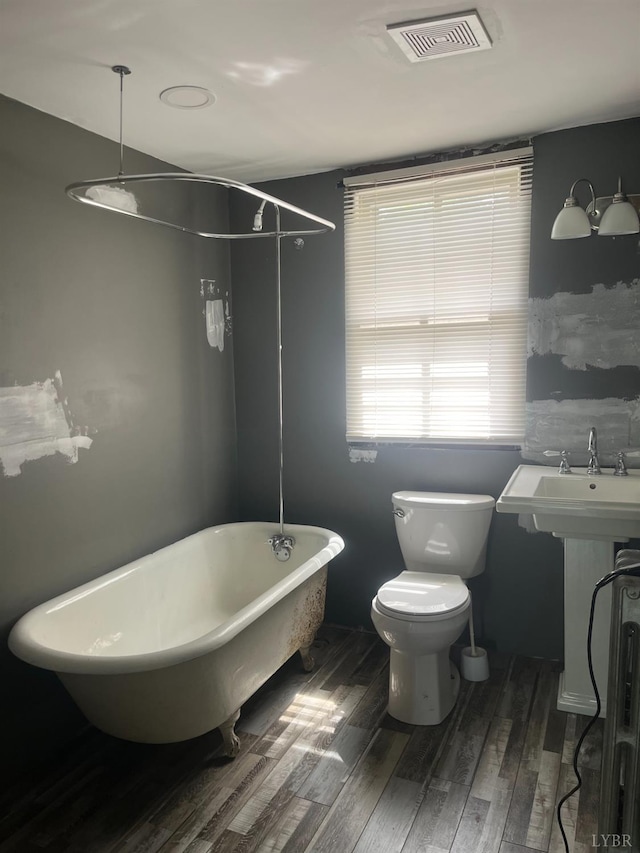 1115 Jackson St, Lynchburg, VA 24504 - full bath with wood finished floors and toilet