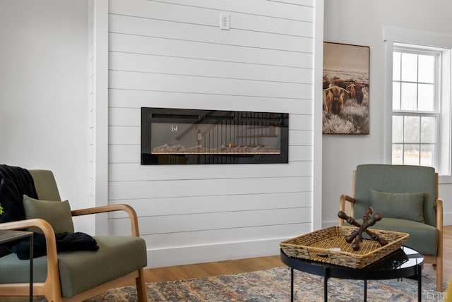 179 Meadow Brook Cir, Danville, VA 24541 - sitting room featuring a large fireplace and wood finished floors