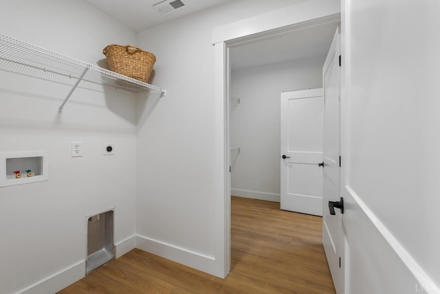 179 Meadow Brook Cir, Danville, VA 24541 - laundry area featuring washer hookup, light wood-style floors, electric dryer hookup, and baseboards