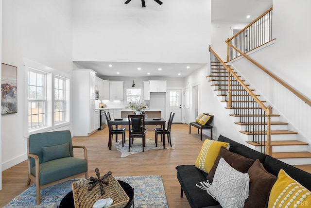 179 Meadow Brook Cir, Danville, VA 24541 - living area featuring a high ceiling, stairs, light wood finished floors, a ceiling fan, and recessed lighting