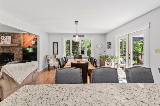 261 Carrington Ln, Roseland, VA 22967 - dining room with french doors, wood finished floors, a fireplace, and baseboards