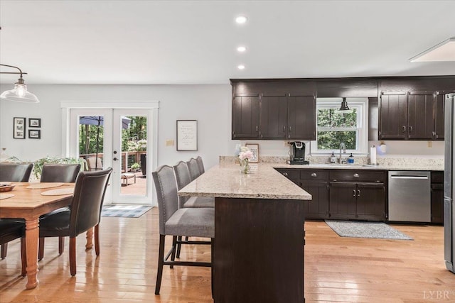 261 Carrington Ln, Roseland, VA 22967 - kitchen featuring stainless steel dishwasher, a sink, a peninsula, french doors, and plenty of natural light