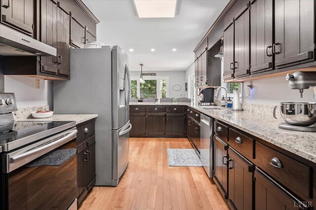 261 Carrington Ln, Roseland, VA 22967 - kitchen featuring appliances with stainless steel finishes, under cabinet range hood, dark brown cabinets, light wood-style floors, and recessed lighting