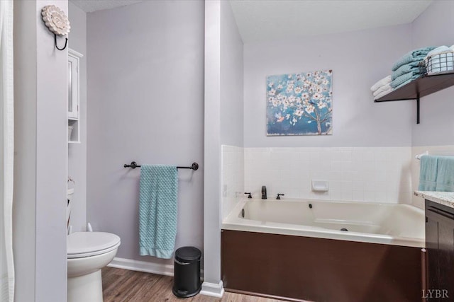 261 Carrington Ln, Roseland, VA 22967 - bathroom featuring a bath, toilet, wood finished floors, baseboards, and vanity
