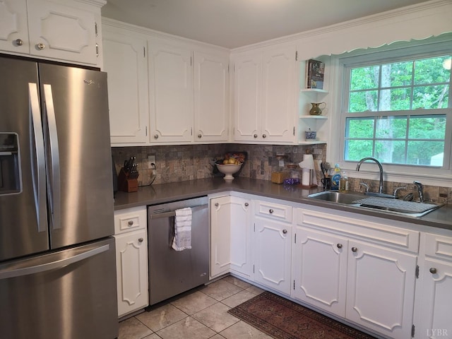356 Ferguson St, Appomattox, VA 24522 - kitchen with stainless steel appliances, a sink, dark countertops, decorative backsplash, and light tile patterned floors