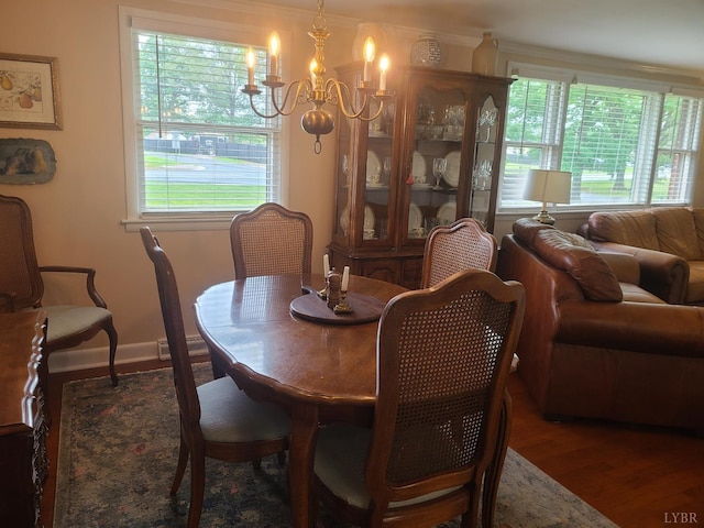 356 Ferguson St, Appomattox, VA 24522 - dining area featuring a chandelier, wood finished floors, crown molding, and baseboards