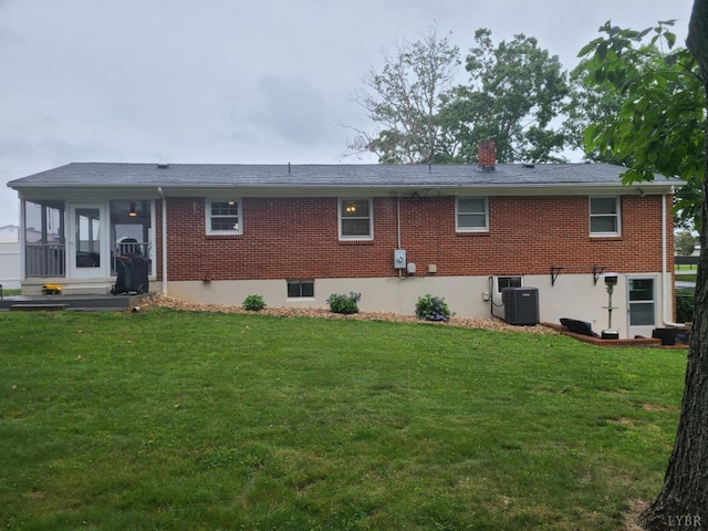 356 Ferguson St, Appomattox, VA 24522 - rear view of property featuring brick siding, a lawn, central air condition unit, and a chimney
