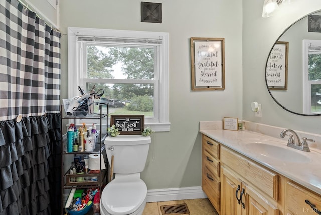 221 Castle Craig Dr, Evington, VA 24550 - bathroom featuring vanity, toilet, baseboards, and tile patterned floors