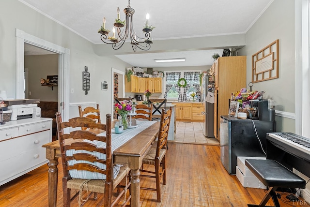 221 Castle Craig Dr, Evington, VA 24550 - dining area featuring ornamental molding, light wood-style flooring, and a chandelier