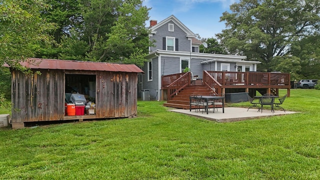 221 Castle Craig Dr, Evington, VA 24550 - rear view of property with a patio, a wooden deck, a chimney, a lawn, and central air condition unit