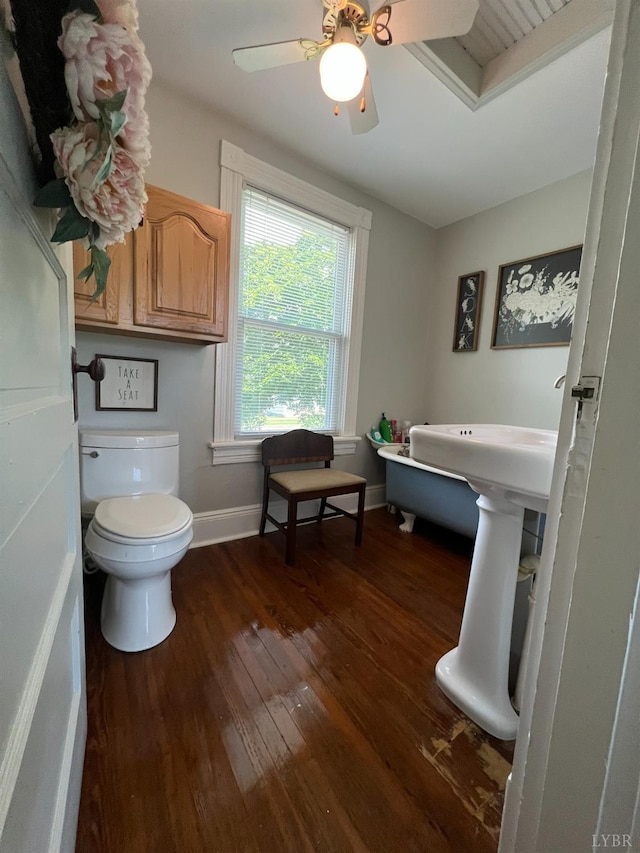 221 Castle Craig Dr, Evington, VA 24550 - bathroom with hardwood / wood-style flooring, toilet, baseboards, and ceiling fan