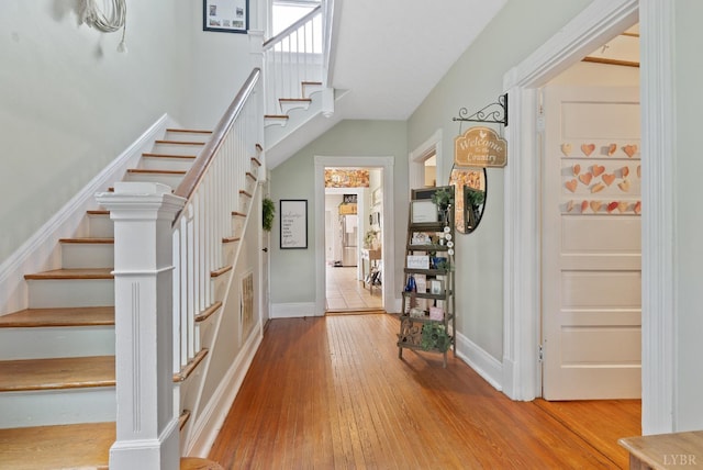 221 Castle Craig Dr, Evington, VA 24550 - foyer entrance with stairway, wood-type flooring, and baseboards