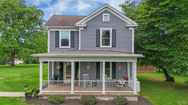 221 Castle Craig Dr, Evington, VA 24550 - view of front facade with a porch and a front lawn