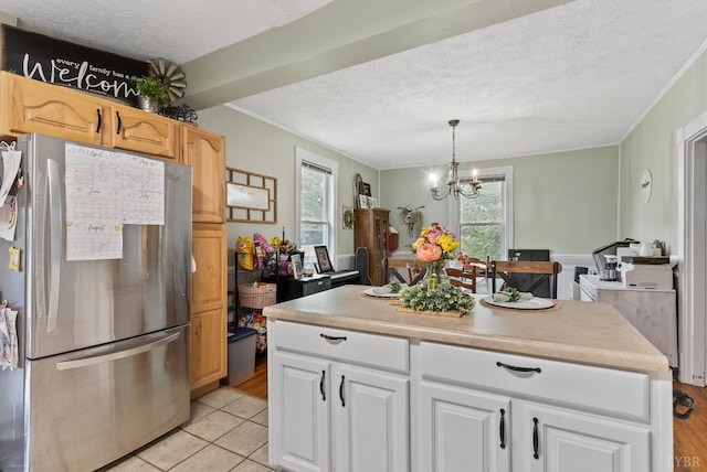 221 Castle Craig Dr, Evington, VA 24550 - kitchen featuring freestanding refrigerator, a textured ceiling, crown molding, a chandelier, and healthy amount of natural light