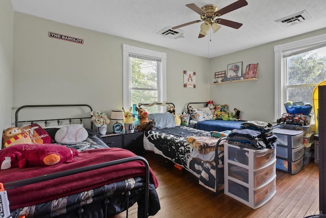 221 Castle Craig Dr, Evington, VA 24550 - bedroom featuring multiple windows, wood-type flooring, and a ceiling fan