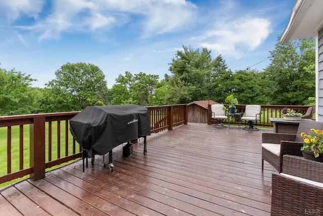 221 Castle Craig Dr, Evington, VA 24550 - wooden terrace featuring area for grilling and view of wooded area