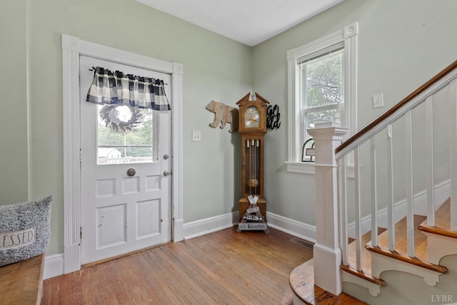 221 Castle Craig Dr, Evington, VA 24550 - foyer entrance with stairs, wood finished floors, and baseboards