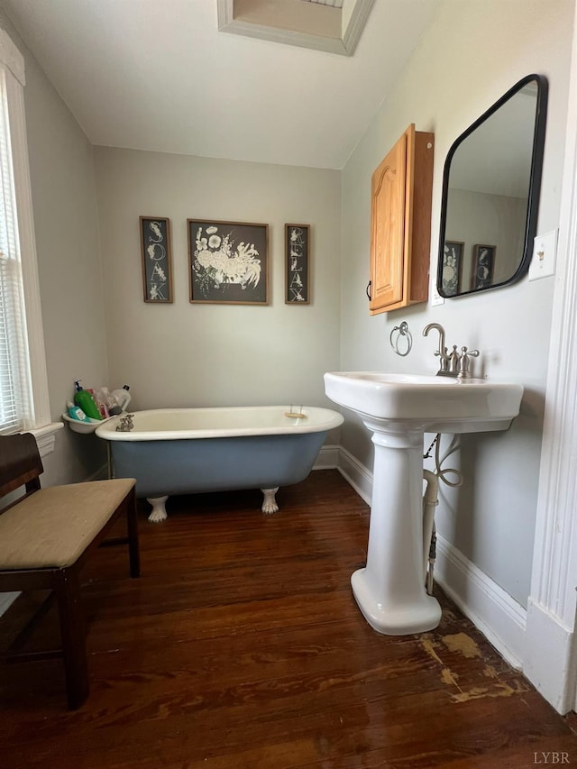 221 Castle Craig Dr, Evington, VA 24550 - full bath featuring a freestanding bath, wood finished floors, and baseboards
