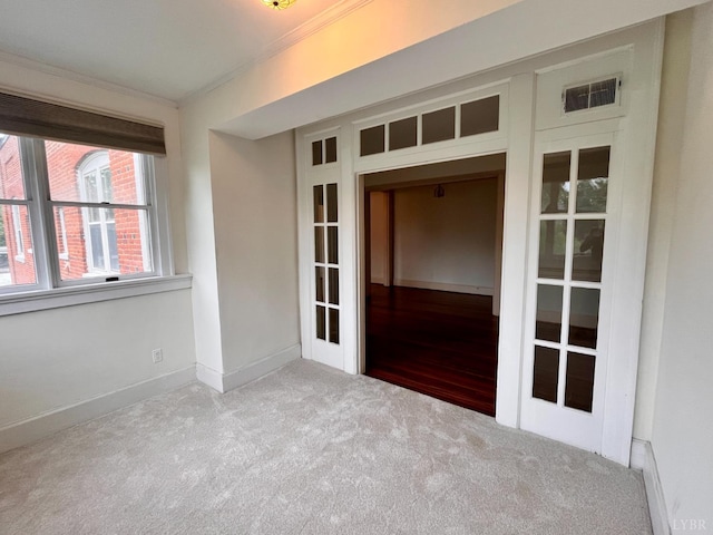 2910 Rivermont Ave Unit 301, Lynchburg, VA 24503 - empty room featuring crown molding, carpet, baseboards, and french doors