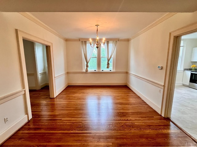 2910 Rivermont Ave Unit 301, Lynchburg, VA 24503 - unfurnished dining area with crown molding, a chandelier, wood finished floors, and baseboards
