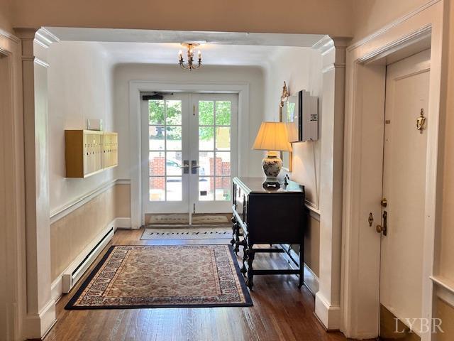 2910 Rivermont Ave Unit 301, Lynchburg, VA 24503 - entryway with baseboard heating, dark wood-type flooring, a chandelier, and french doors