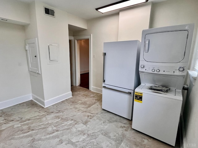 2910 Rivermont Ave Unit 301, Lynchburg, VA 24503 - laundry area featuring stacked washer / drying machine, baseboards, and electric panel