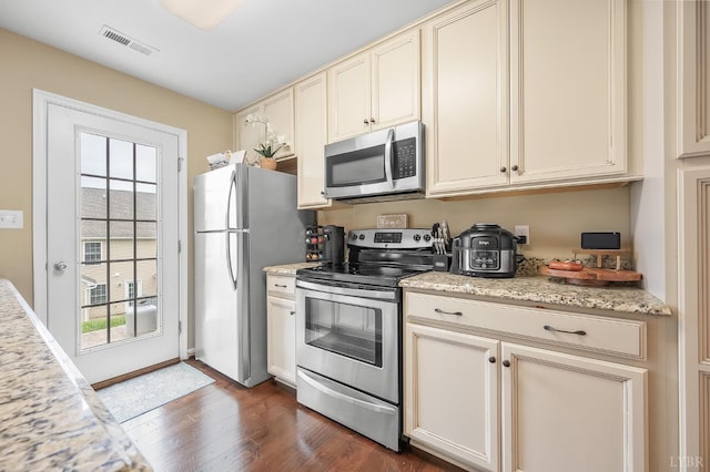 62 Squire Cir, Lynchburg, VA 24501 - kitchen featuring appliances with stainless steel finishes, cream cabinetry, healthy amount of natural light, and dark wood-style floors