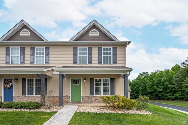 62 Squire Cir, Lynchburg, VA 24501 - view of front of home featuring a front yard, brick siding, and covered porch