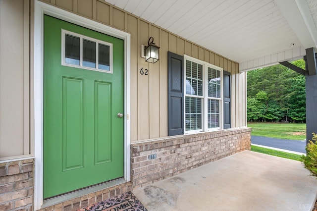 62 Squire Cir, Lynchburg, VA 24501 - property entrance with a porch, brick siding, and board and batten siding