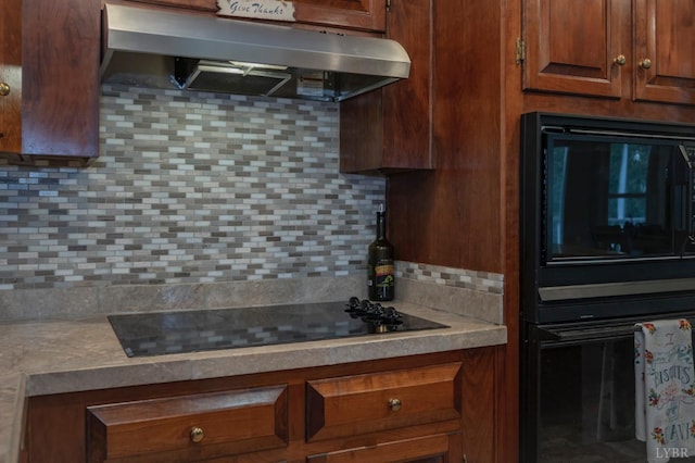 220 Swan Ln, Forest, VA 24551 - kitchen with under cabinet range hood, black electric cooktop, tasteful backsplash, and light countertops