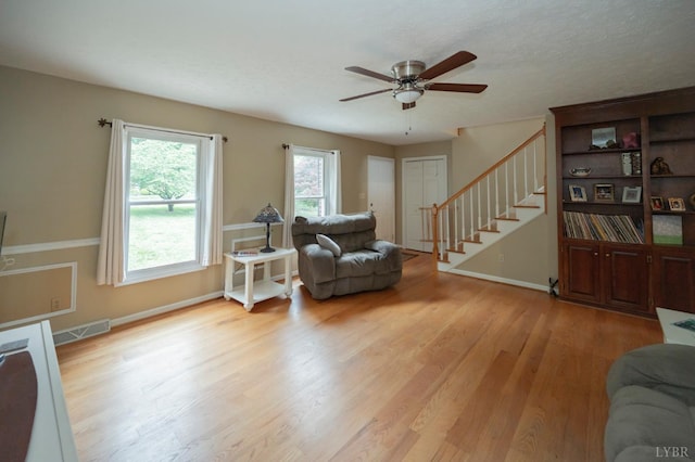 220 Swan Ln, Forest, VA 24551 - living area with stairway, ceiling fan, light wood finished floors, and baseboards