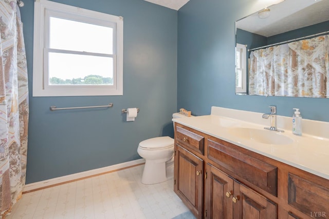 220 Swan Ln, Forest, VA 24551 - bathroom with vanity, toilet, tile patterned floors, and baseboards