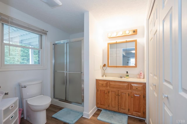 220 Swan Ln, Forest, VA 24551 - full bath featuring vanity, a shower stall, toilet, wood finished floors, and a textured ceiling