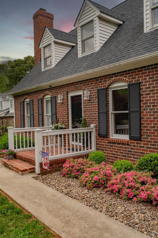220 Swan Ln, Forest, VA 24551 - view of front of house featuring brick siding, a chimney, and roof with shingles