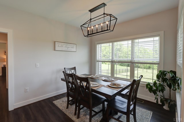 1151 Jefferson Meadows Dr, Forest, VA 24551 - dining area featuring baseboards, dark wood-type flooring, and a chandelier