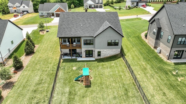 1151 Jefferson Meadows Dr, Forest, VA 24551 - rear view of property featuring a residential view, a shingled roof, french doors, and a yard