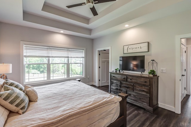 1151 Jefferson Meadows Dr, Forest, VA 24551 - bedroom featuring dark wood-style flooring, baseboards, recessed lighting, a tray ceiling, and a ceiling fan