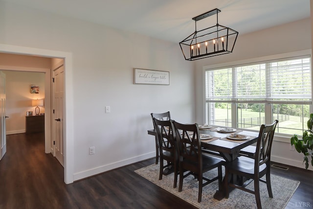1151 Jefferson Meadows Dr, Forest, VA 24551 - dining area featuring baseboards, dark wood-style flooring, and a chandelier