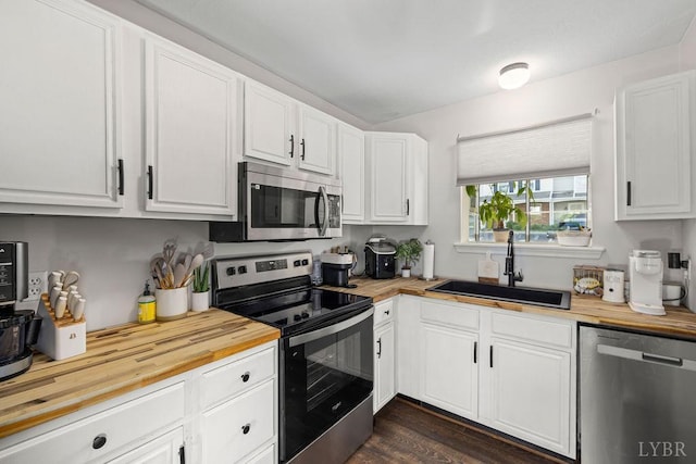 14 Jefferson Village Dr, Forest, VA 24551 - kitchen featuring stainless steel appliances, butcher block countertops, a sink, and white cabinetry
