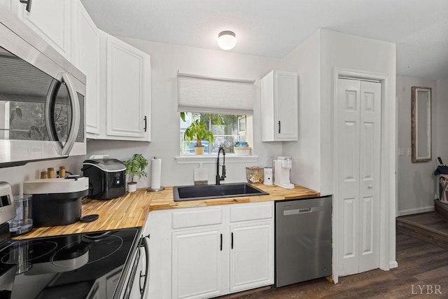 14 Jefferson Village Dr, Forest, VA 24551 - kitchen featuring stainless steel appliances, wood counters, a sink, dark wood-type flooring, and white cabinets