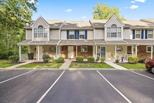 14 Jefferson Village Dr, Forest, VA 24551 - townhome / multi-family property featuring a porch, uncovered parking, and brick siding