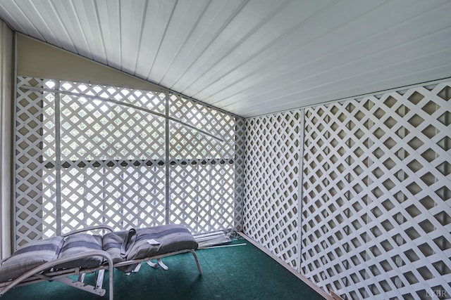unfurnished sunroom with vaulted ceiling