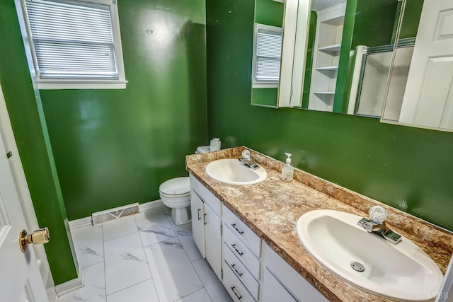 full bathroom featuring double vanity, plenty of natural light, a stall shower, and marble finish floors