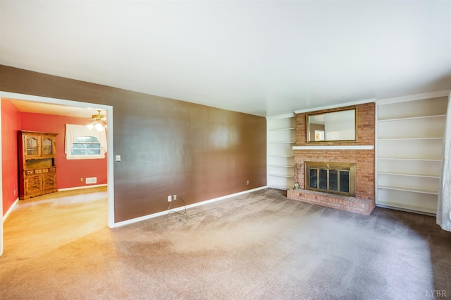 201 Oakland Cir, Lynchburg, VA 24502 - unfurnished living room featuring carpet, a brick fireplace, baseboards, and built in shelves