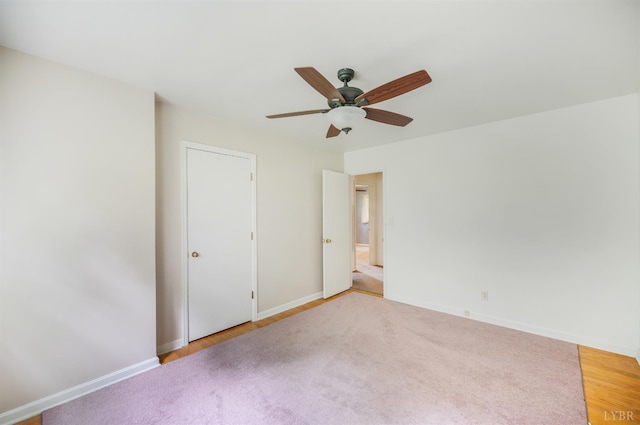 201 Oakland Cir, Lynchburg, VA 24502 - unfurnished bedroom featuring baseboards, light colored carpet, and a ceiling fan