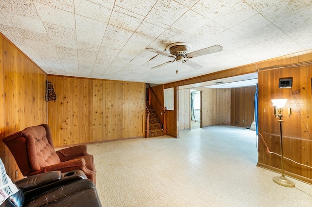 201 Oakland Cir, Lynchburg, VA 24502 - unfurnished room featuring wood walls, stairway, a ceiling fan, and tile patterned floors