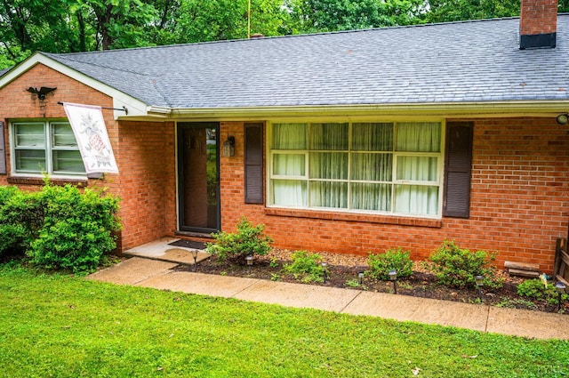 201 Oakland Cir, Lynchburg, VA 24502 - ranch-style home with a chimney, roof with shingles, brick siding, and a front yard