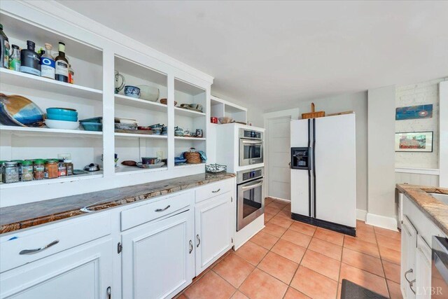 400 E Randolph Pl, Lynchburg, VA 24503 - kitchen featuring white fridge with ice dispenser, oven, open shelves, and light stone counters